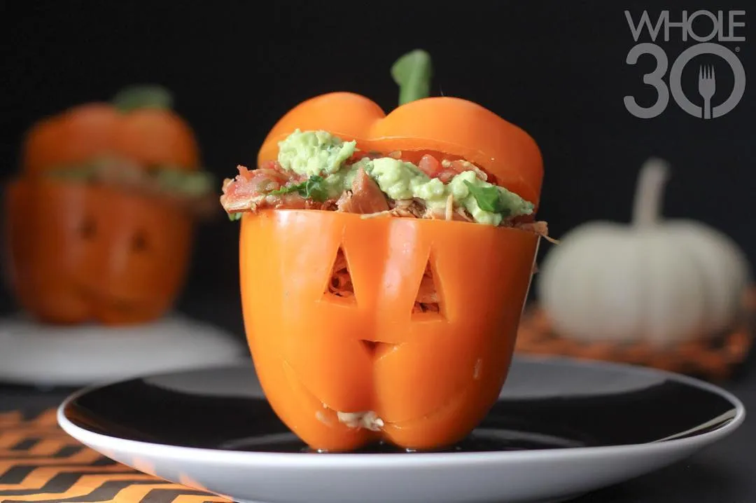 orange bell pepper stuffed with guacamole