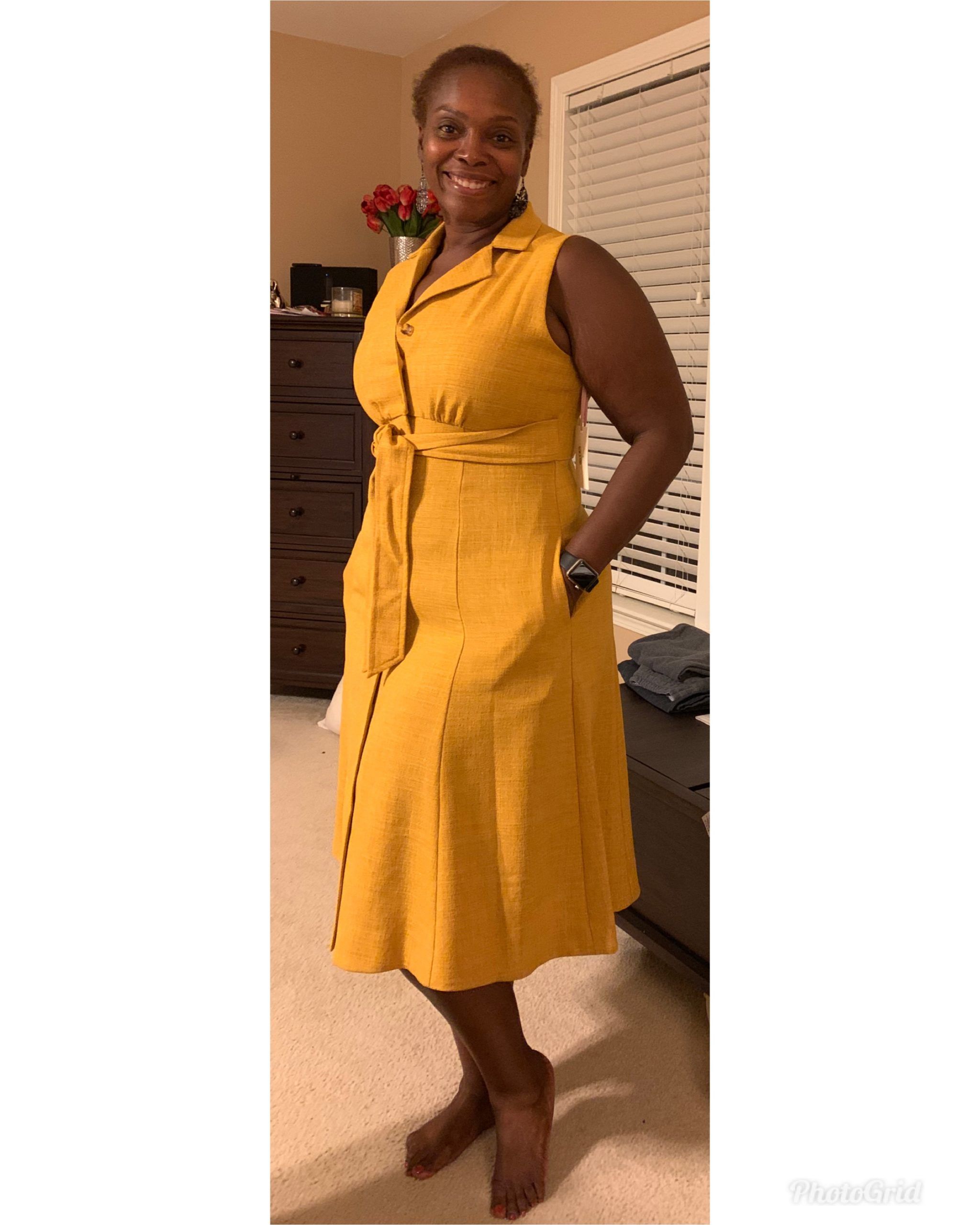 Jakelia Sledge in a yellow dress smiling