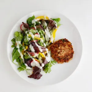 Salmon patties with salad