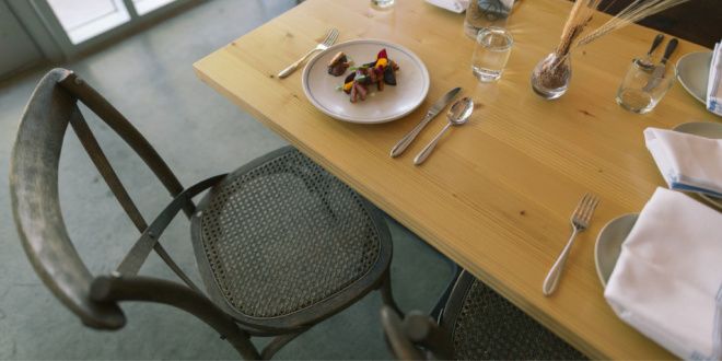 Kitchen table with plates and silverware
