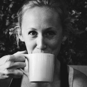 Amy Hester sipping out of a coffee mug