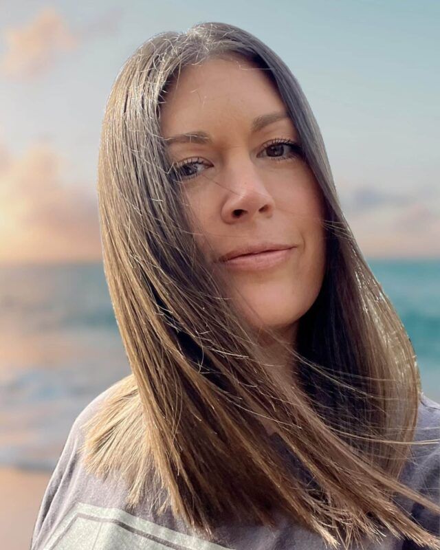 Natasha Zygaczenko smiling at the camera.