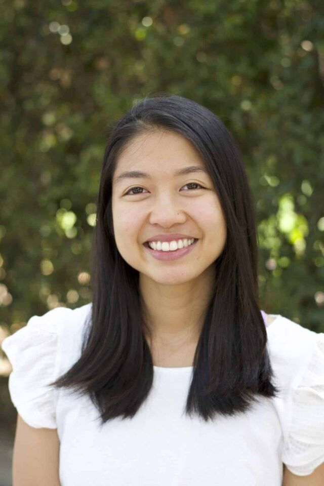 Ellie Yamanaka from ellielikescooking wearing a white top and smiling at the camera.