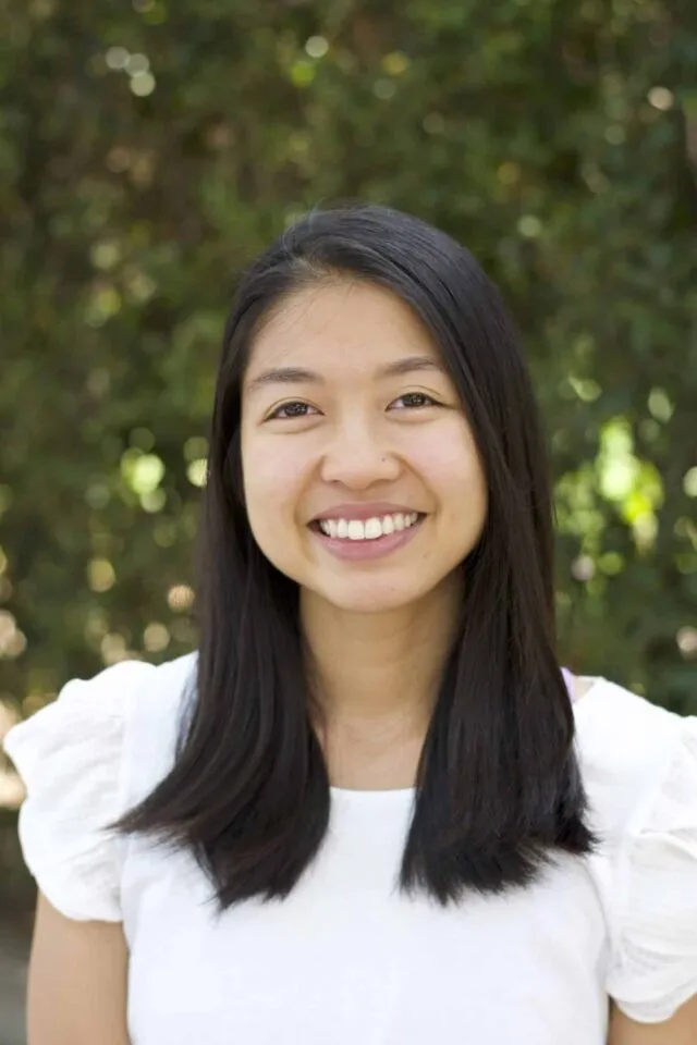 Ellie Yamanaka from ellielikescooking wearing a white top and smiling at the camera.