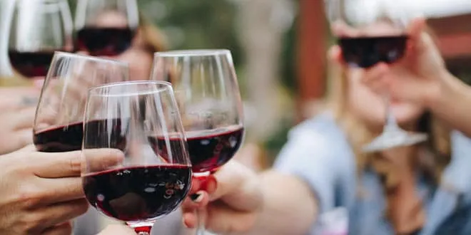 Glasses of wine clinking together