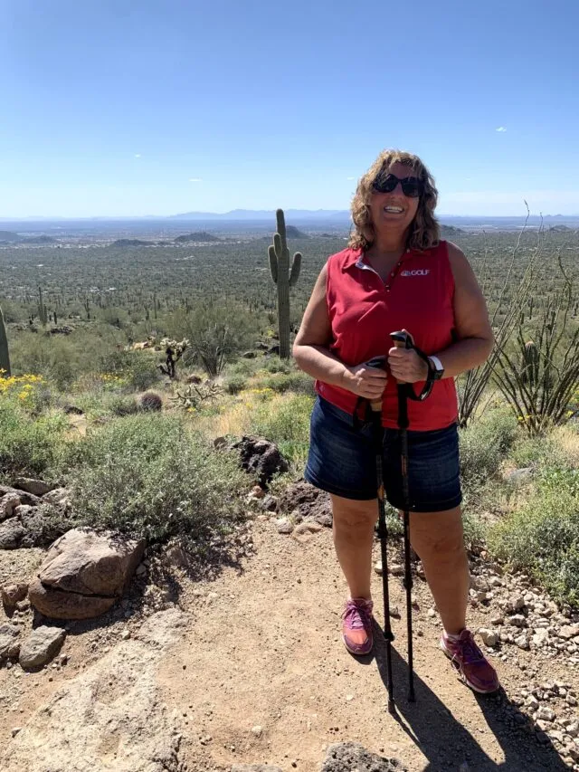 Teri standing in a desert