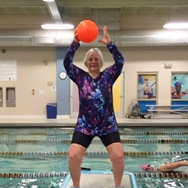 profile-Edie|Edie on top of a board in a pool