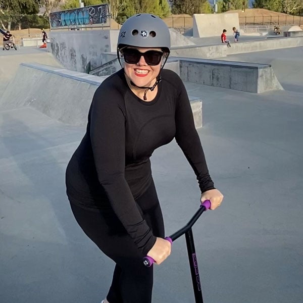 Holly on a scooter at a skate park|Holly on a scooter at a skate park