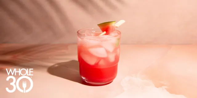 Watermelon Basil Fizz Mocktail on light pink marble background