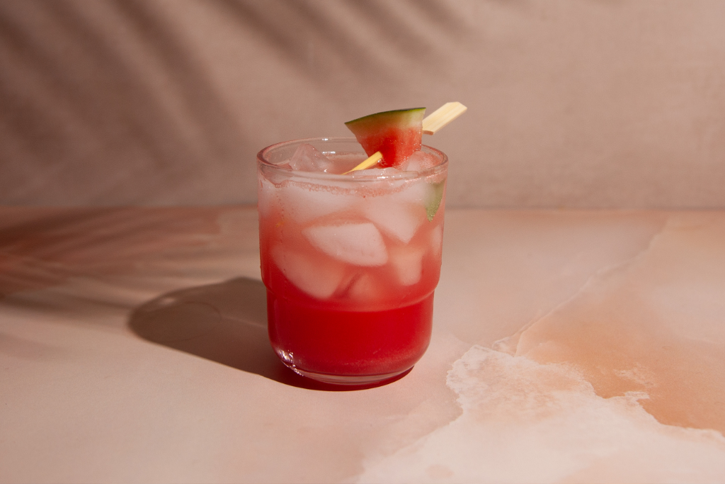 Watermelon Basil Fizz Mocktail on light pink marble background